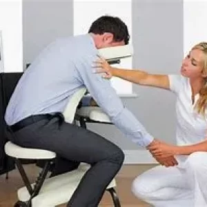 Caucasian-female-giving-chair-massage-1.webp