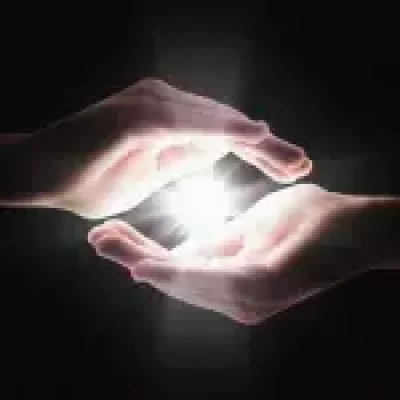 Reiki-two-hands-with-energy-ball-in-the-center.webp